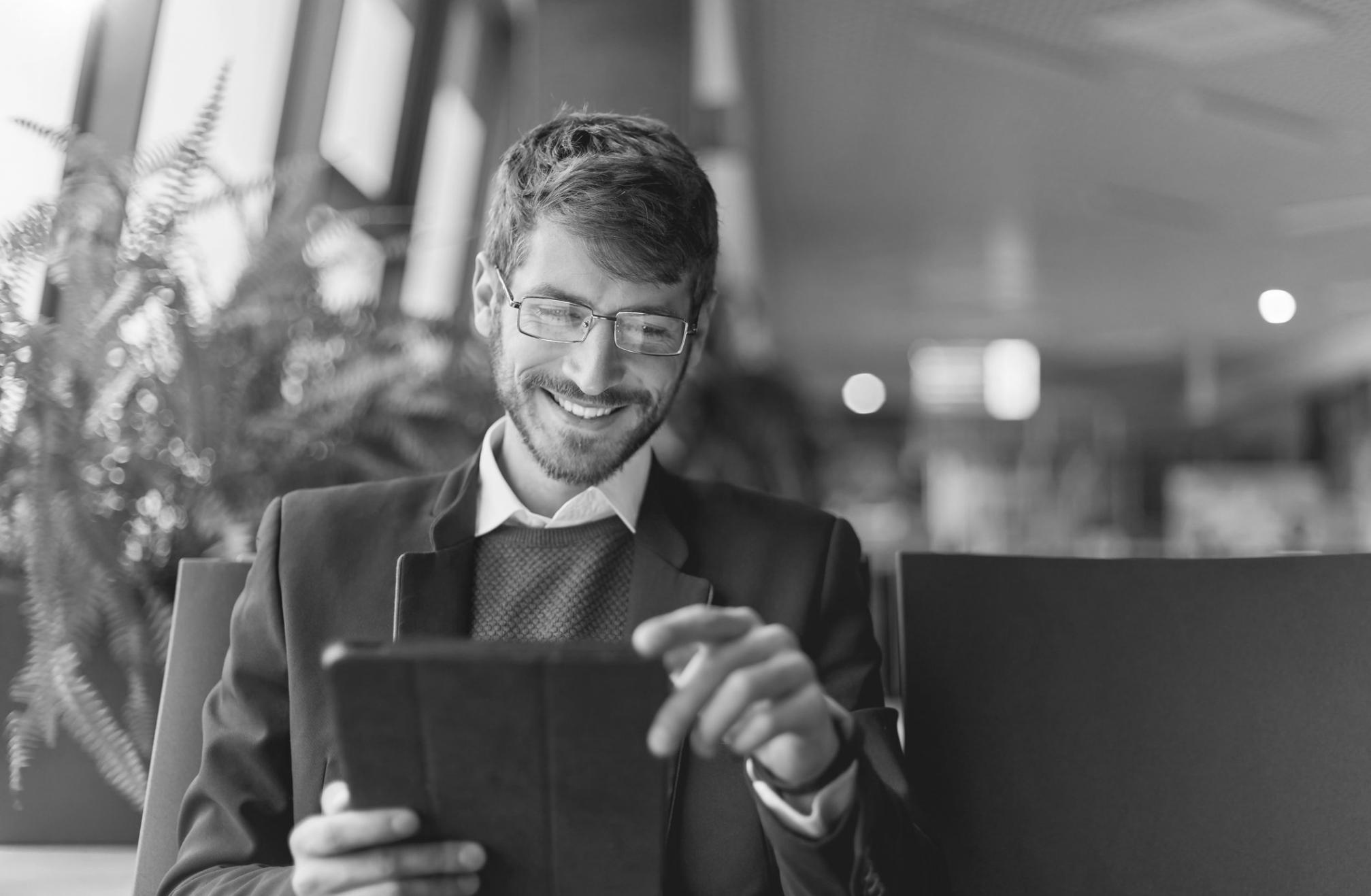 Developer reviewing a finished mobile application on a physical device